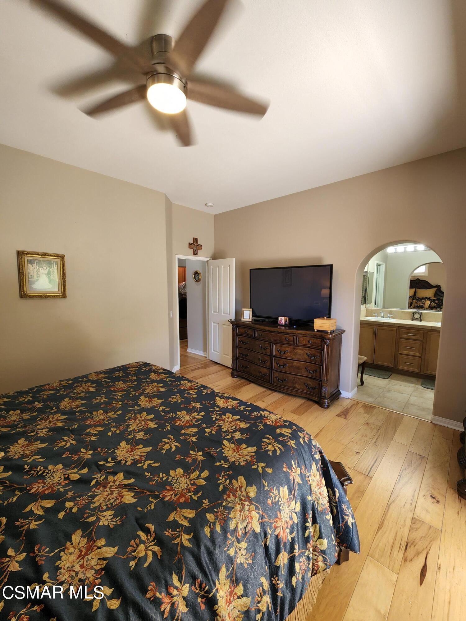 4121 Paredo Way, Unit D Simi Valley, CA 93063 - Photo 27 of 35 a bedroom with a bed and a television