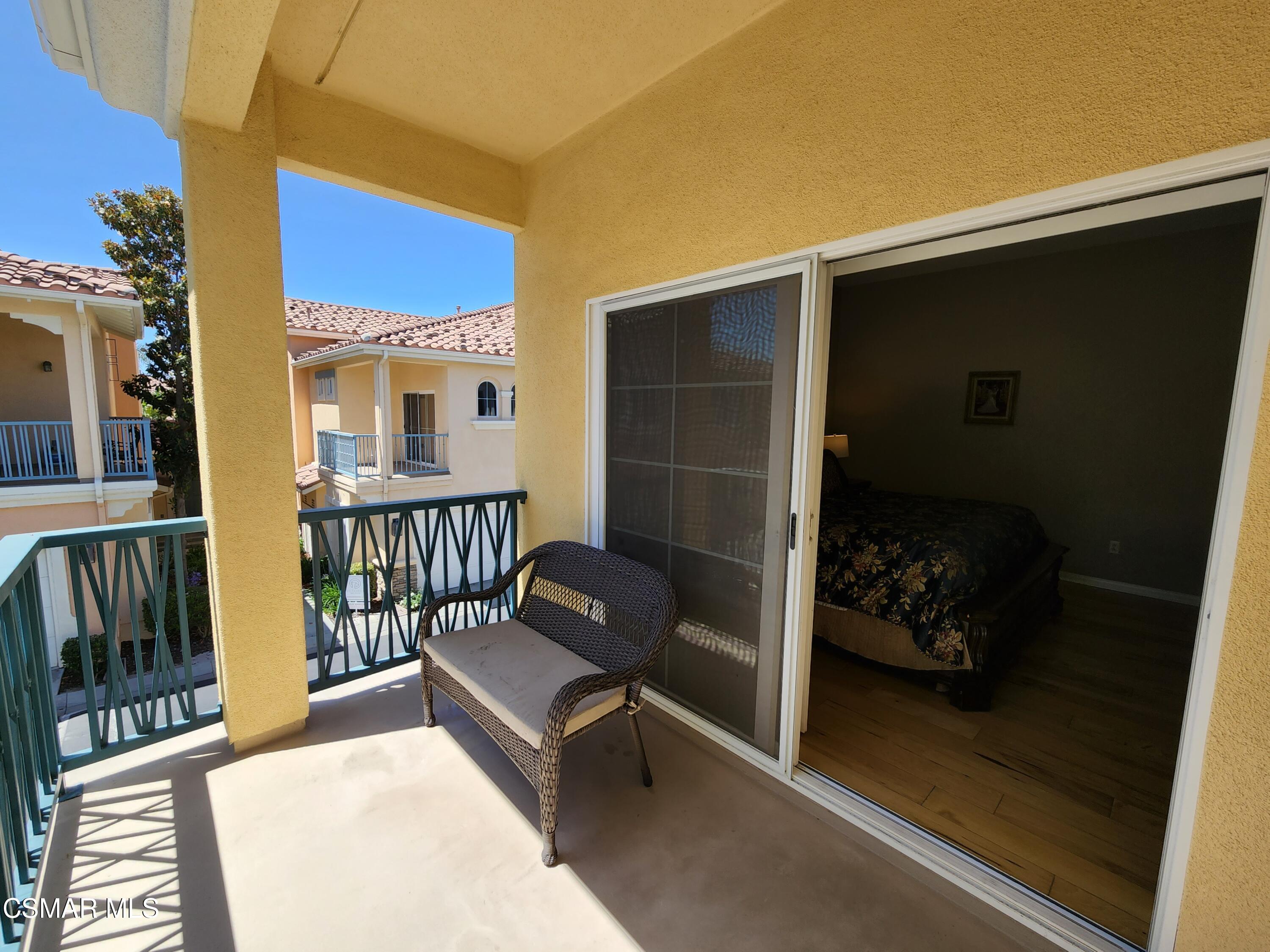 4121 Paredo Way, Unit D Simi Valley, CA 93063 - Photo 29 of 35 a balcony with furniture and book shelf