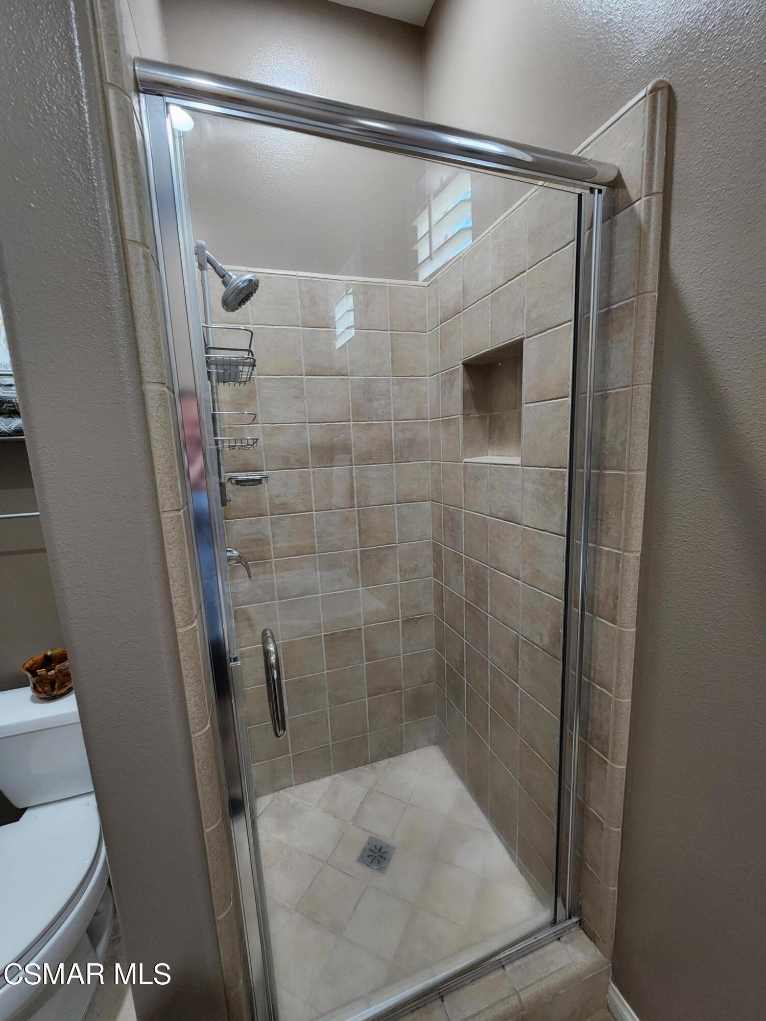 4121 Paredo Way, Unit D Simi Valley, CA 93063 - Photo 32 of 35 a bathroom with a shower and toilet