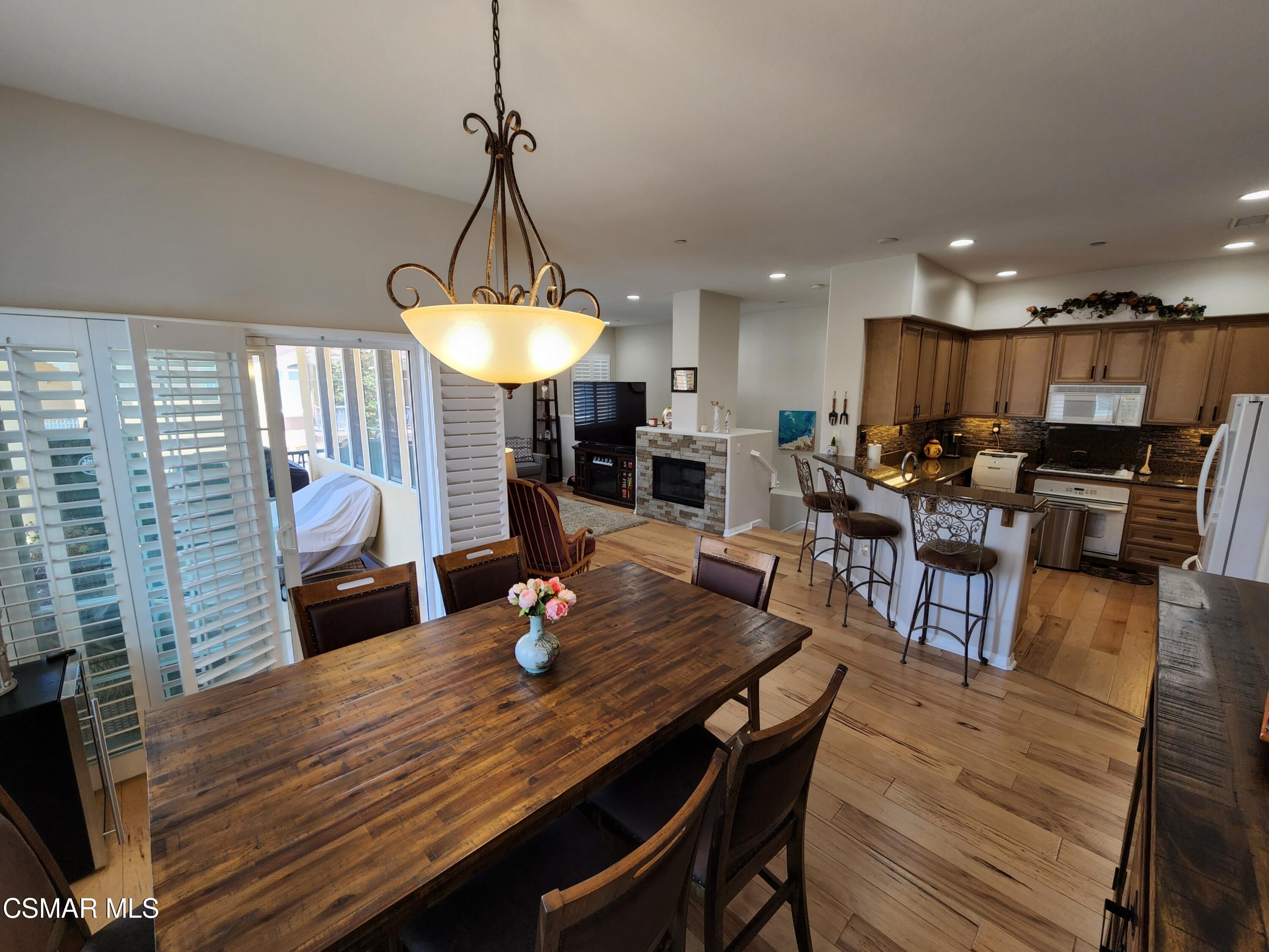 4121 Paredo Way, Unit D Simi Valley, CA 93063 - Photo 34 of 35 a view of a dining room with furniture window and wooden floor