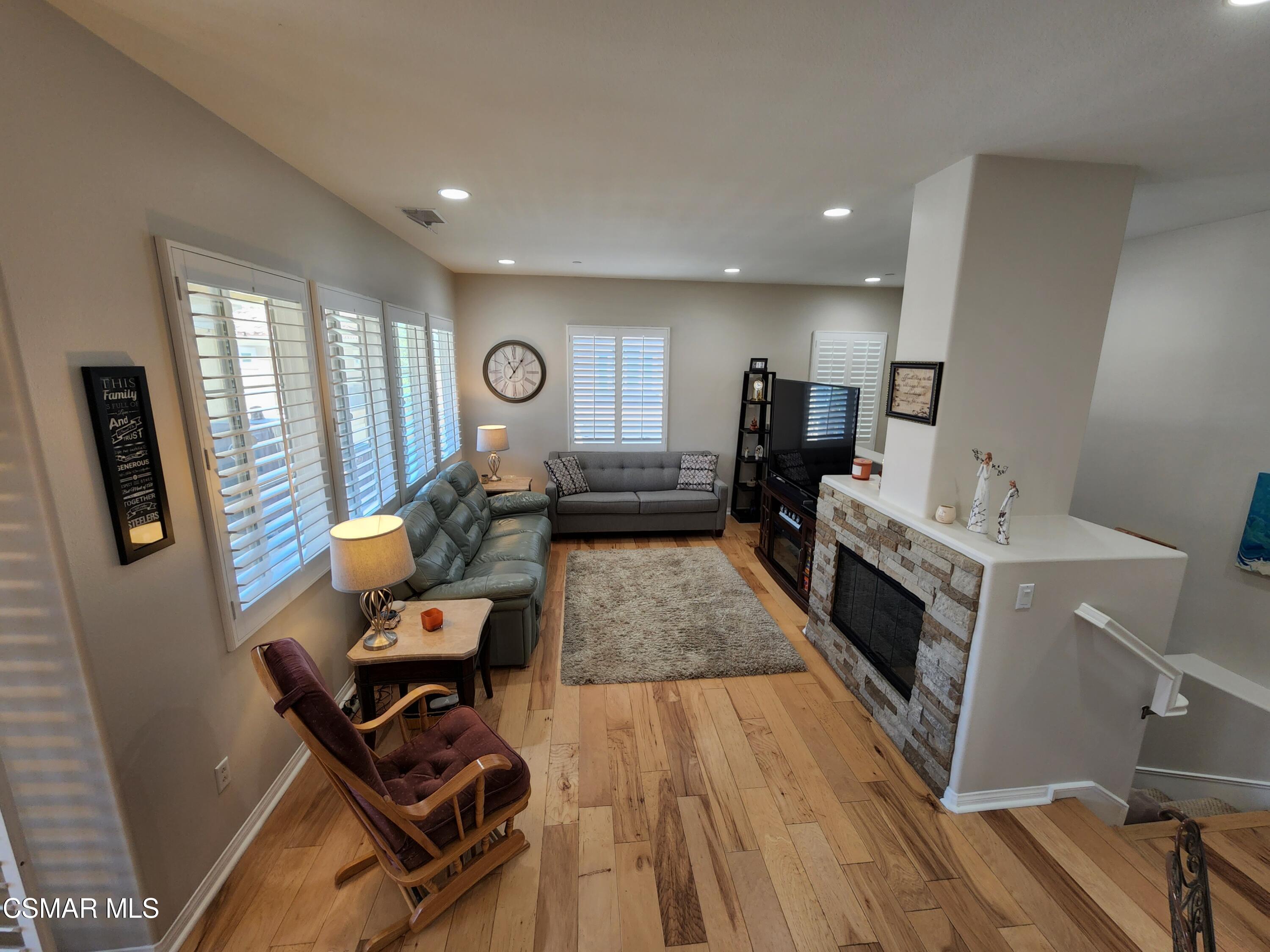 4121 Paredo Way, Unit D Simi Valley, CA 93063 - Photo 7 of 35 a living room with furniture and a wooden floor