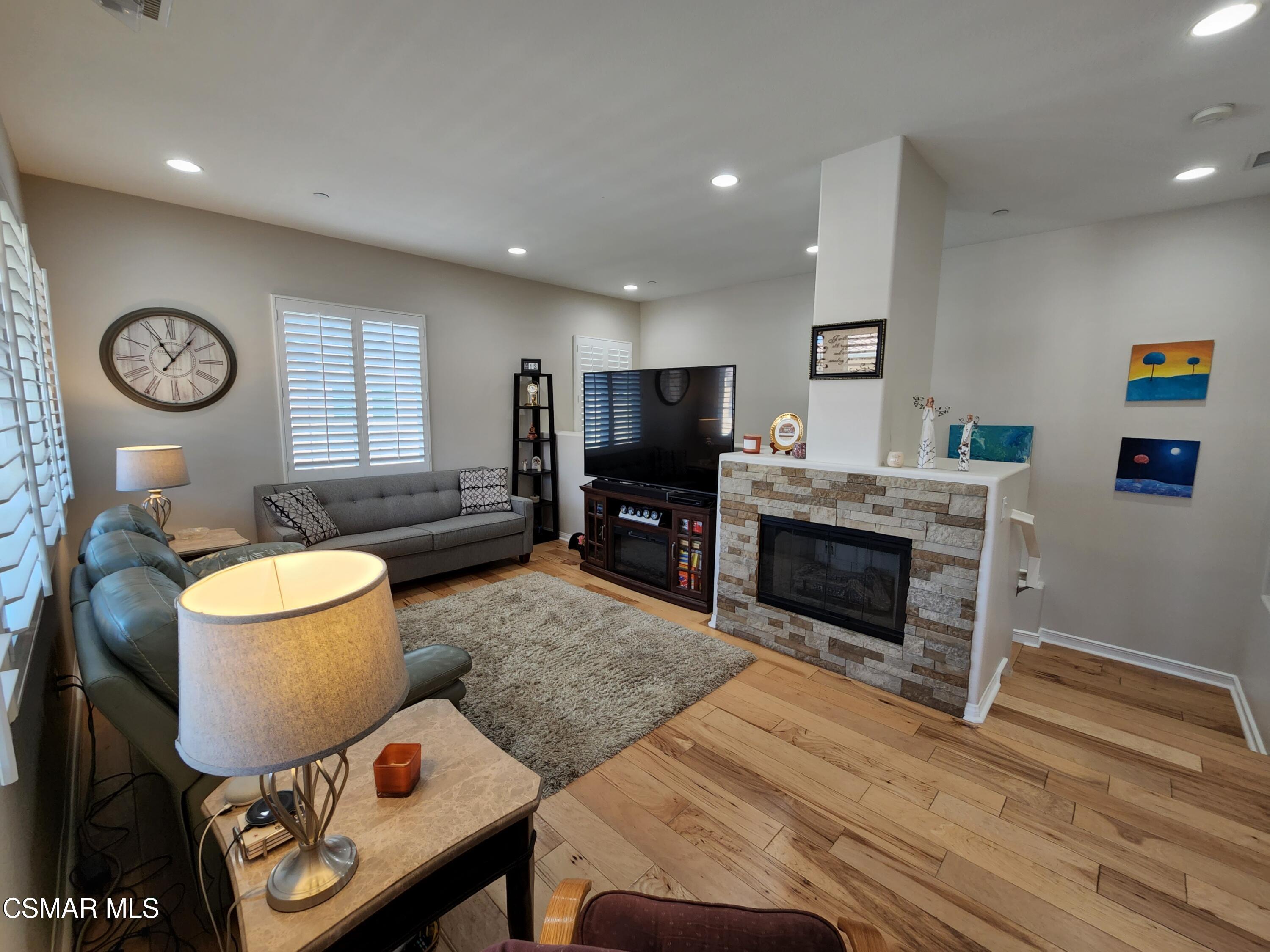 4121 Paredo Way, Unit D Simi Valley, CA 93063 - Photo 8 of 35 a living room with furniture and a fireplace