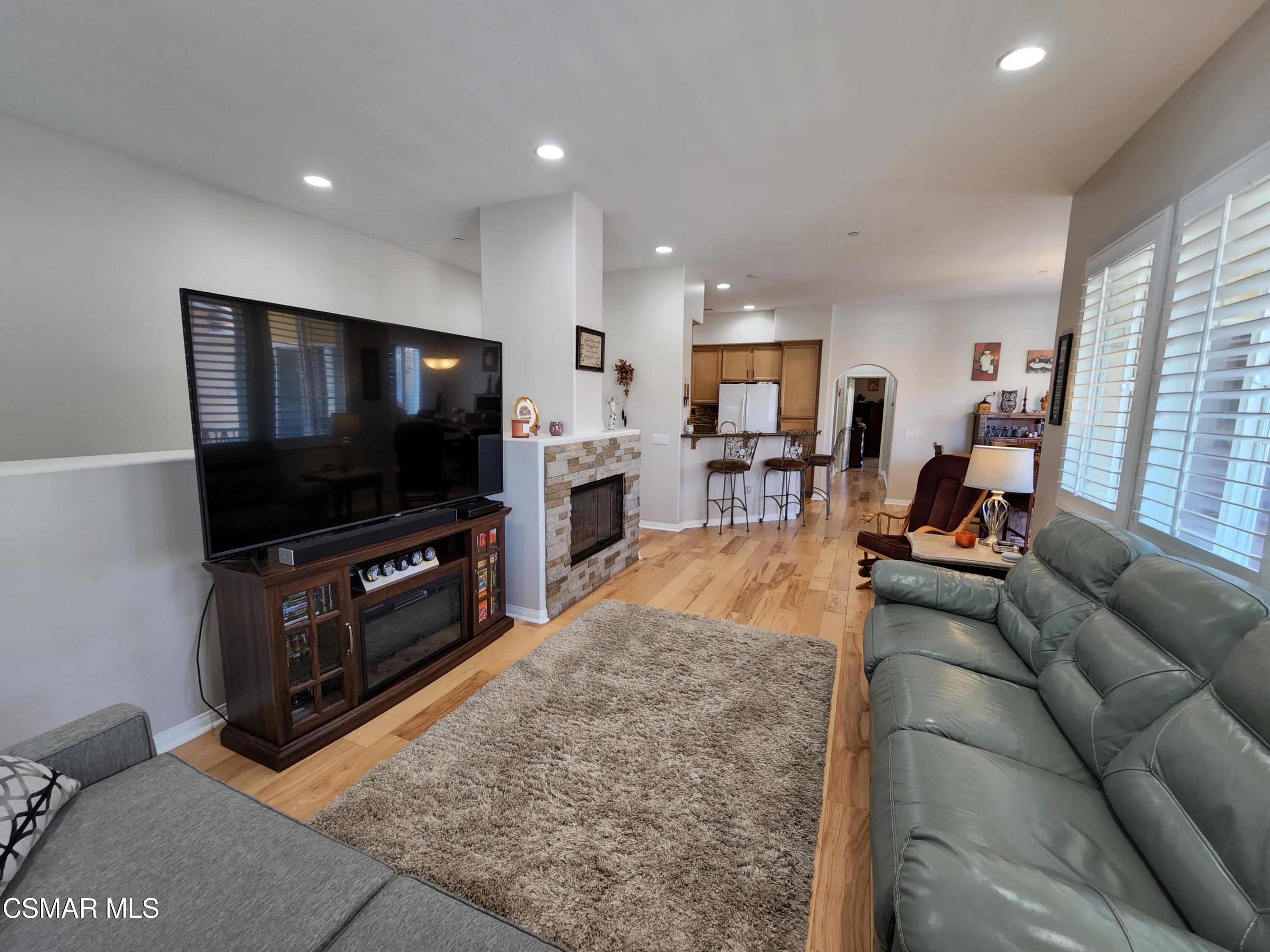 4121 Paredo Way, Unit D Simi Valley, CA 93063 - Photo 9 of 35 a living room with furniture and a flat screen tv