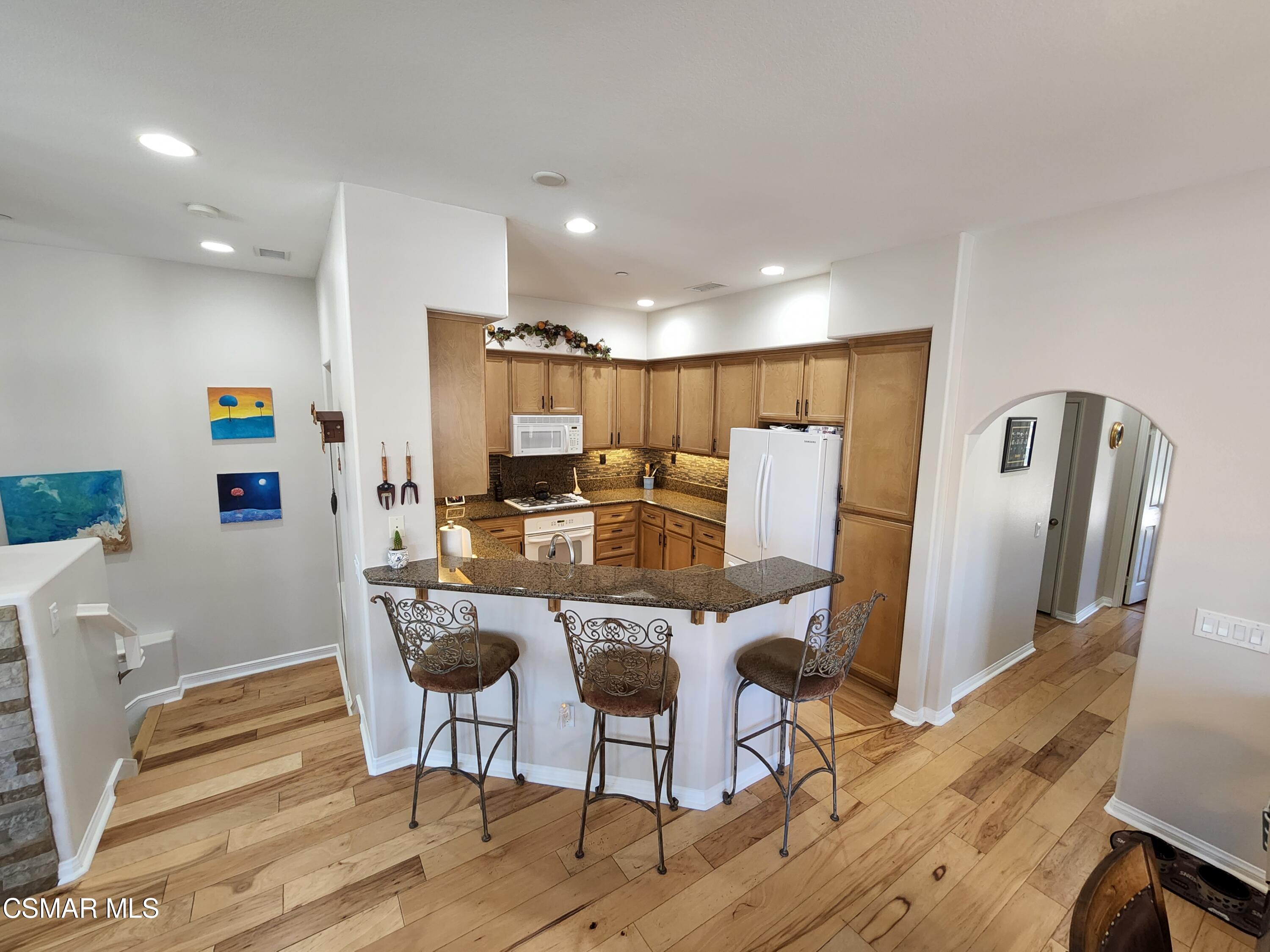 4121 Paredo Way, Unit D Simi Valley, CA 93063 - Photo 10 of 35 a view of a dining room with furniture and wooden floor