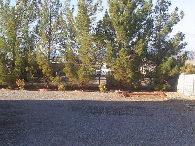 5840 Doubletree Road Pahrump, NV 89061 - Photo 21 of 24 Property Photo. PINES LINE THE BACK OF LOT, GARDEN AREA