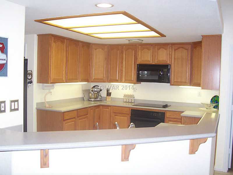 5840 Doubletree Road Pahrump, NV 89061 - Photo 6 of 24 Property Photo. KITCHEN WITH CORIAN, WALKIN PANTRY, PULLOUTS, COUNTER LIGHTING, APPL S STAY