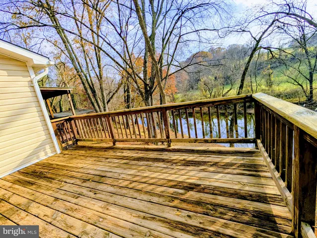 a view of staircase with wooden floor and fence