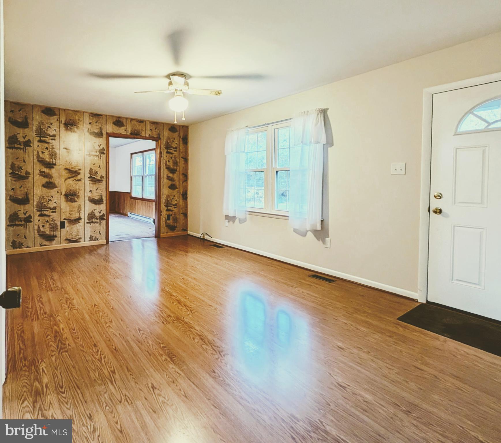 7403 Bear Branch Road Adamstown, MD 21710 - Photo 3 of 43 an empty room with wooden floor and windows