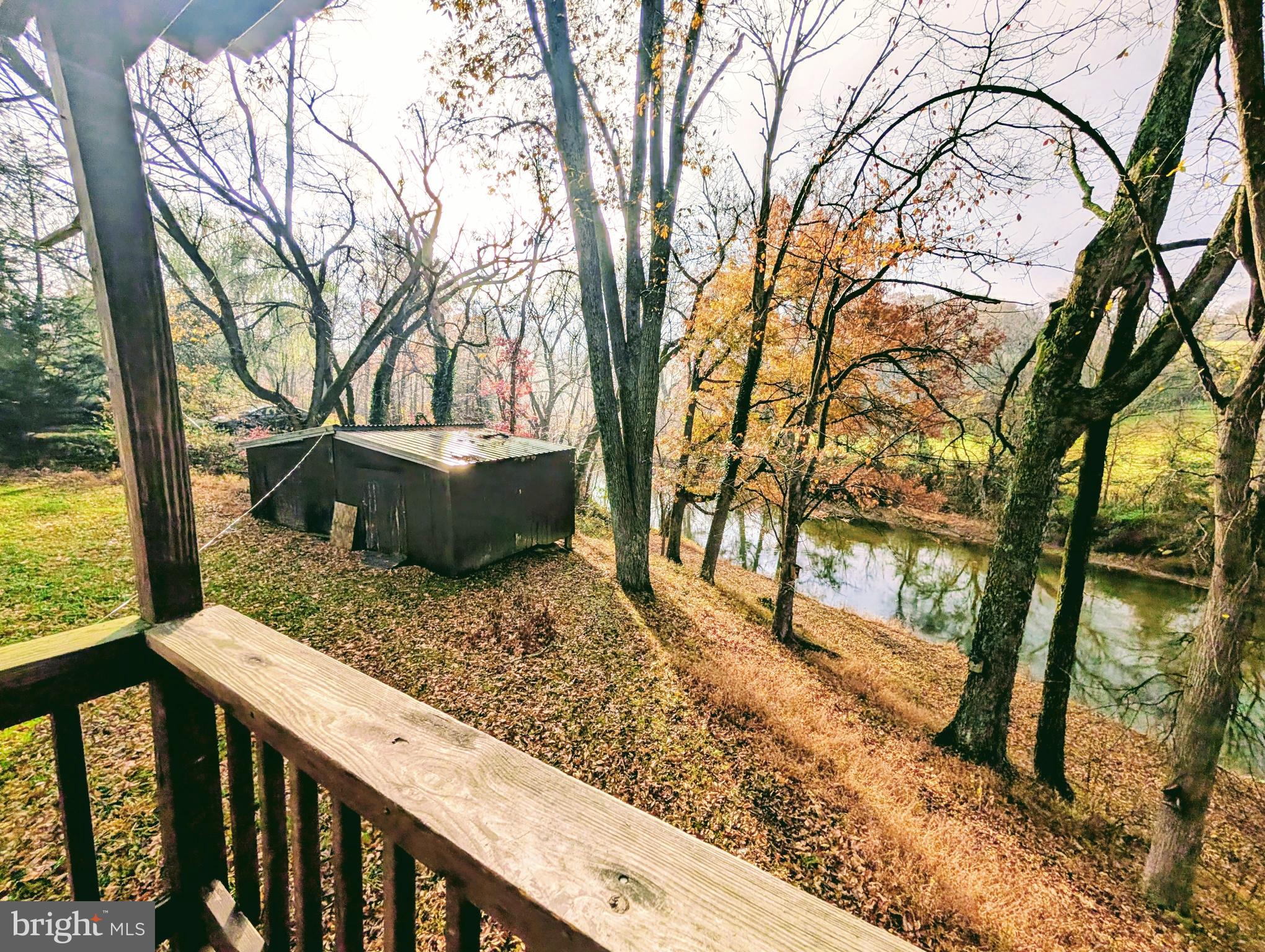 7403 Bear Branch Road Adamstown, MD 21710 - Photo 32 of 43 a view of a backyard with wooden fence