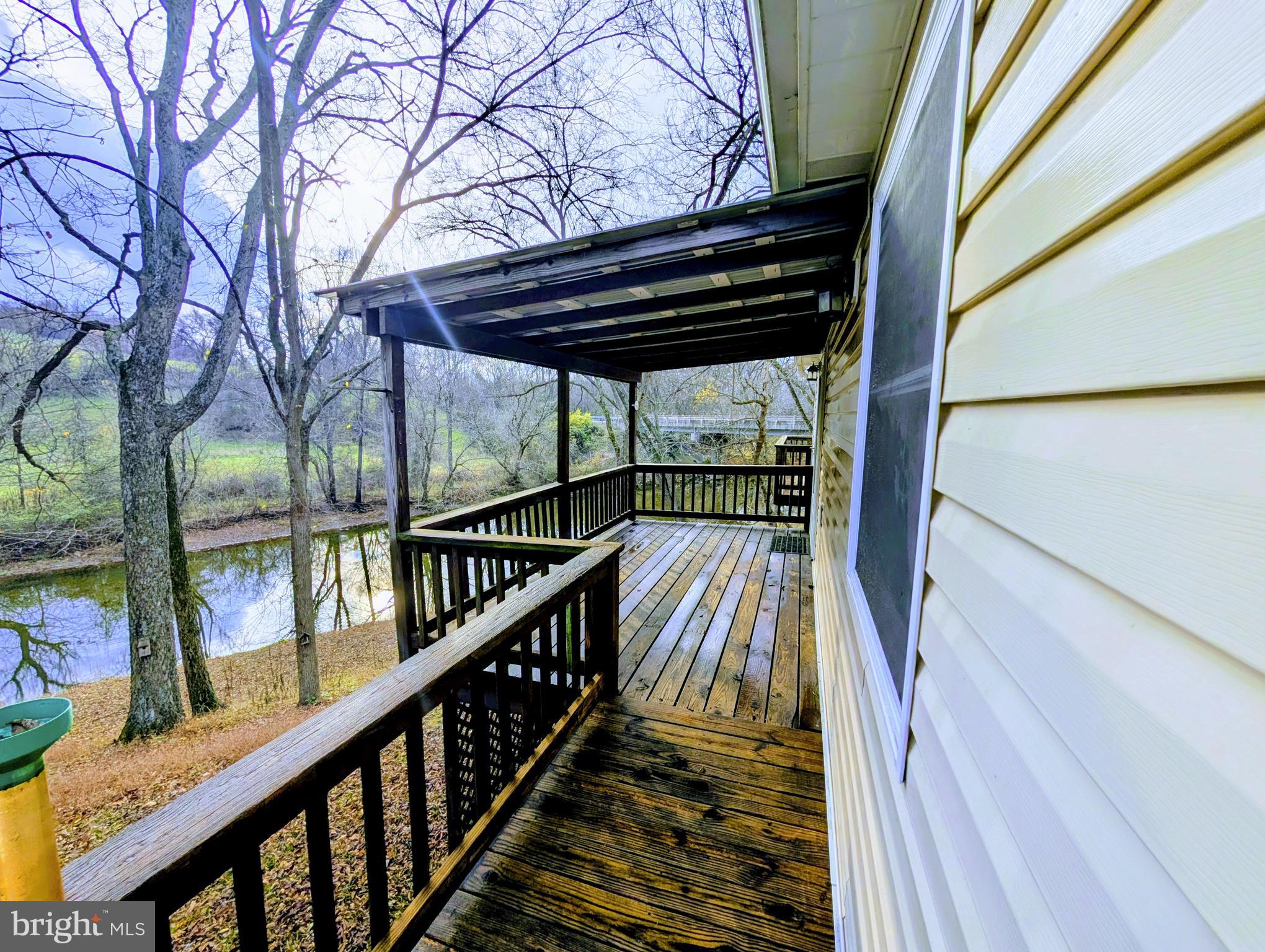 7403 Bear Branch Road Adamstown, MD 21710 - Photo 33 of 43 a view of staircase with wooden floor and fence
