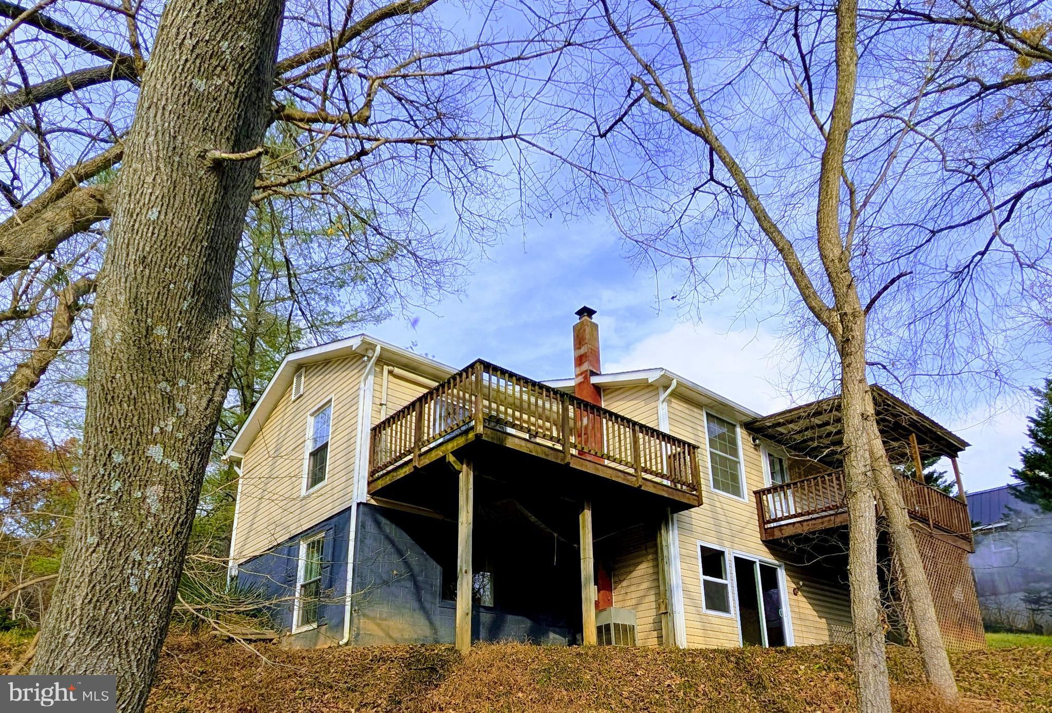 7403 Bear Branch Road Adamstown, MD 21710 - Photo 34 of 43 front view of a house with a small yard