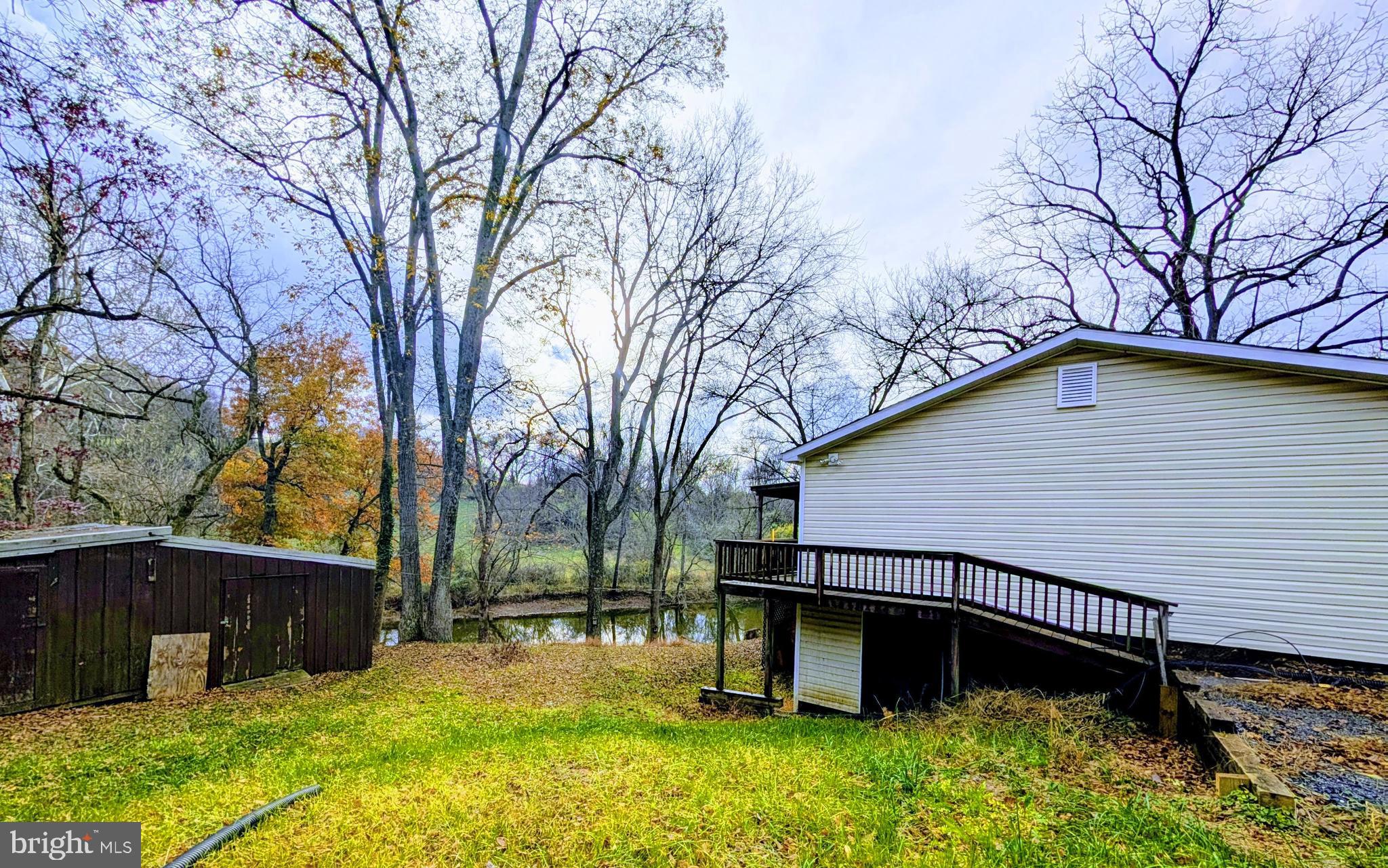 7403 Bear Branch Road Adamstown, MD 21710 - Photo 36 of 43 a view of a house with a yard and trees