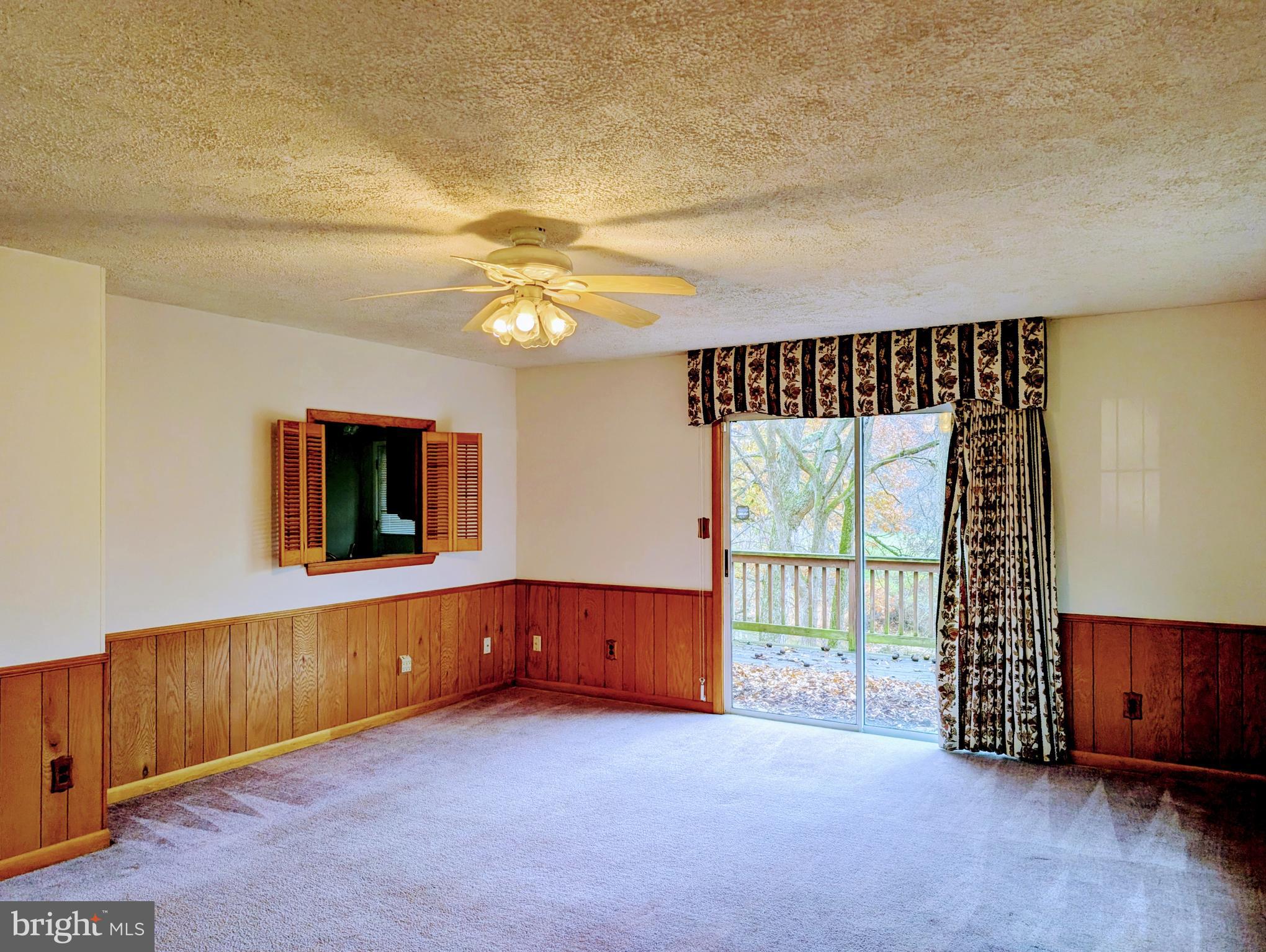 7403 Bear Branch Road Adamstown, MD 21710 - Photo 8 of 43 wooden floor in an empty room with a window