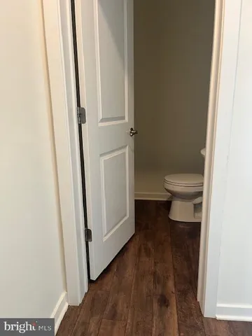 a bathroom view of a toilet and a sink