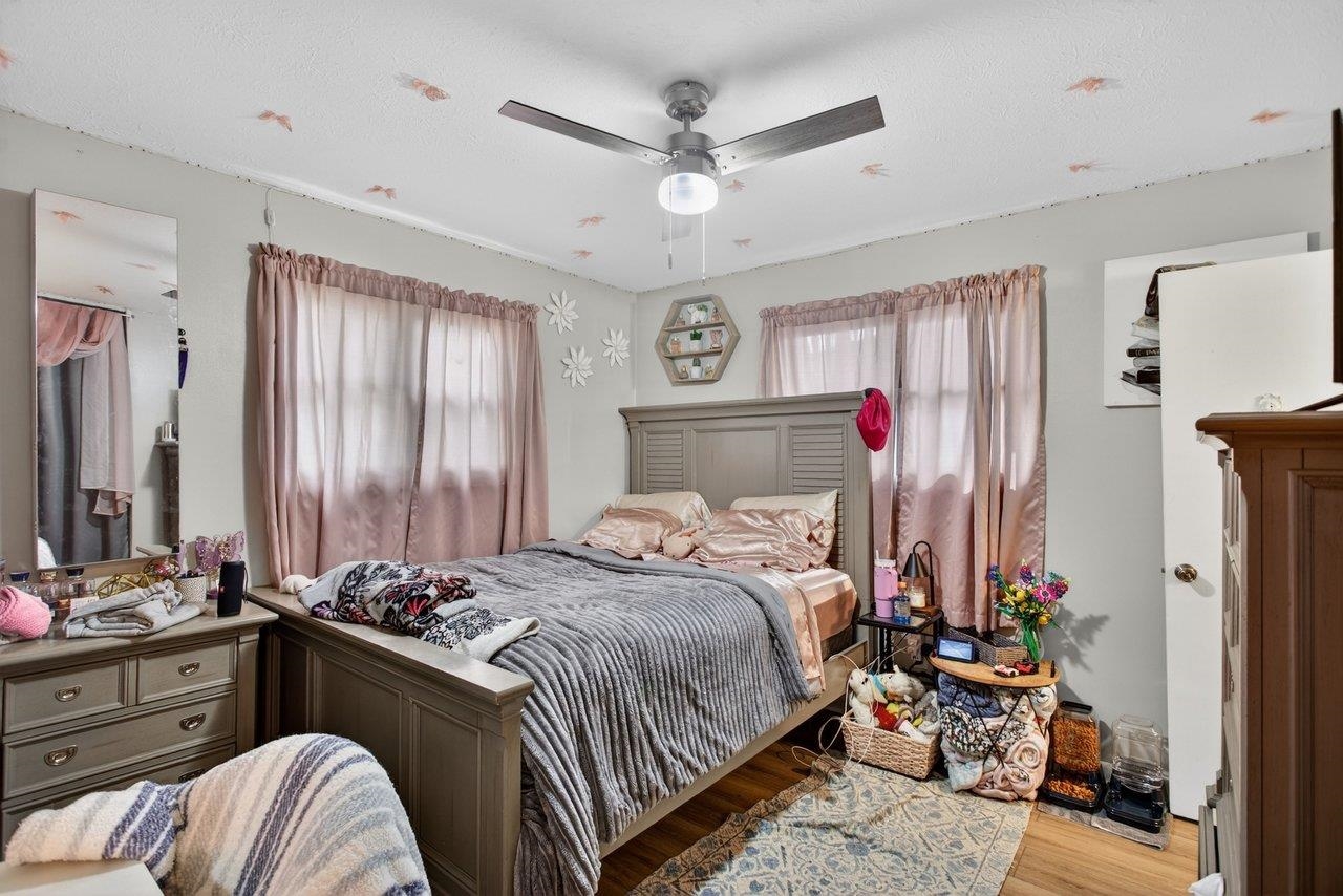 220 Rockingham Drive Harrisonburg, VA 22802 - Photo 24 of 40 a bedroom with a bed and a chandelier