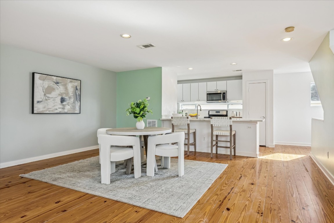 2508 Calumet Street, Unit E Houston, TX 77004 - Photo 20 of 31 a living room with stainless steel appliances kitchen island granite countertop furniture and wooden floor