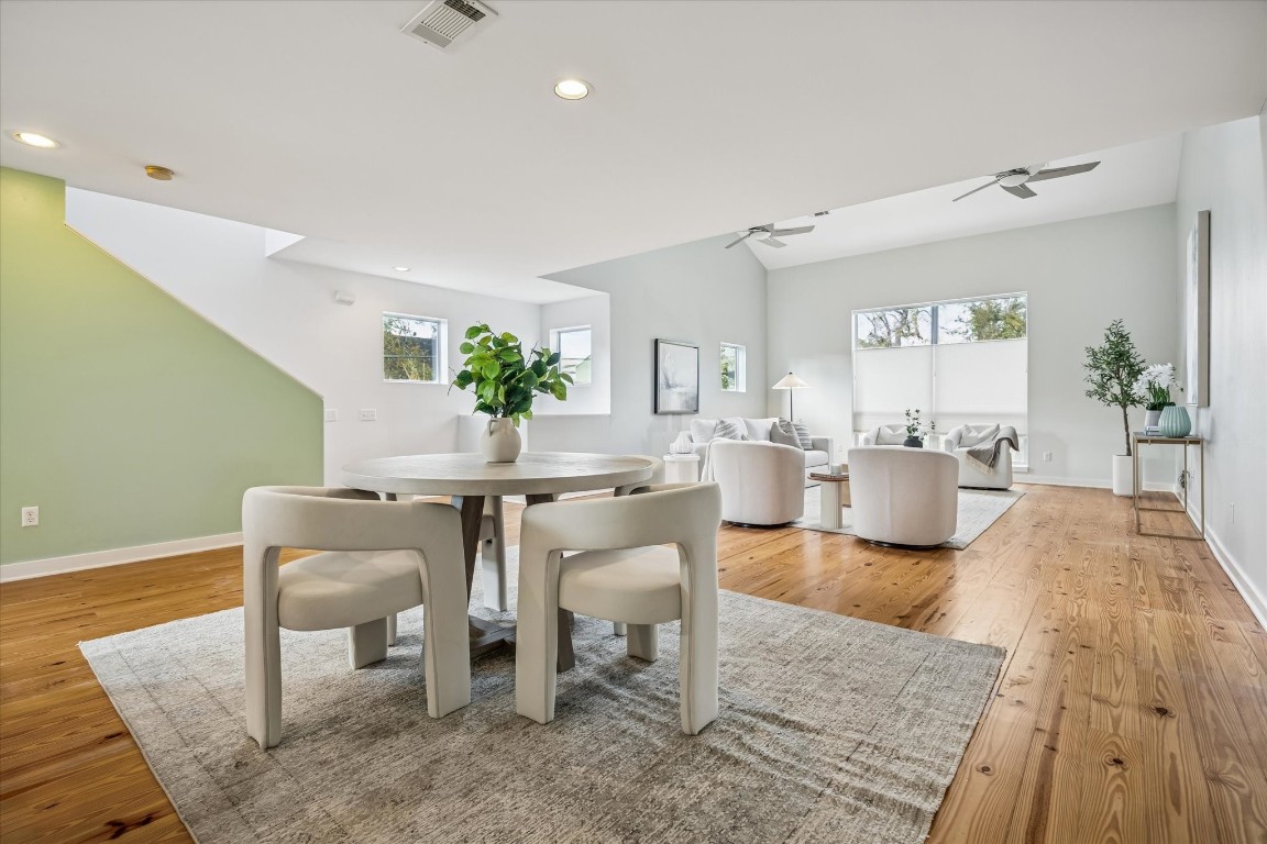 2508 Calumet Street, Unit E Houston, TX 77004 - Photo 2 of 31 a living room with furniture a wooden floor and a chandelier