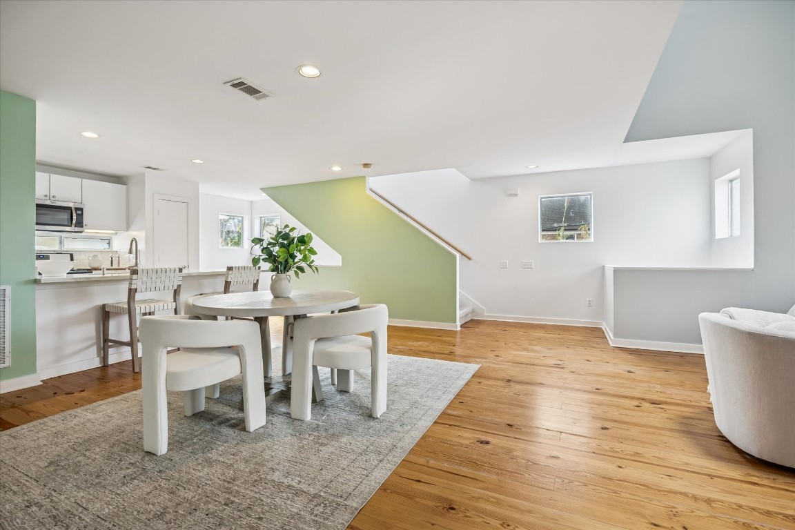 2508 Calumet Street, Unit E Houston, TX 77004 - Photo 21 of 31 a view of a dining room with furniture and wooden floor