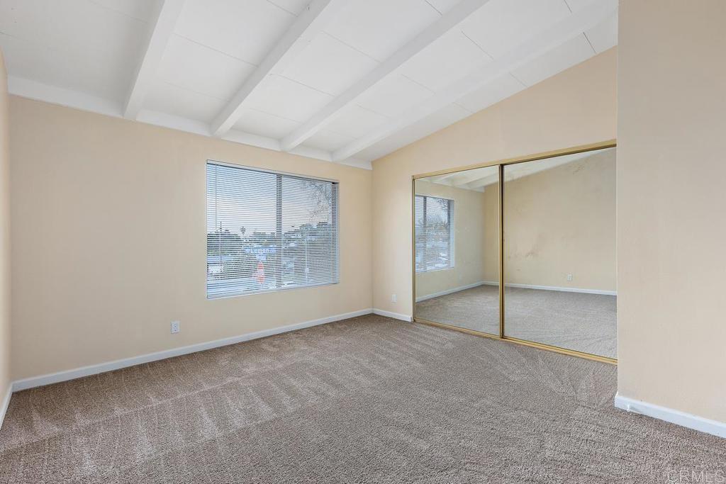 921 Lemon Avenue Vista, CA 92084 - Photo 18 of 32 an empty room with closet and windows