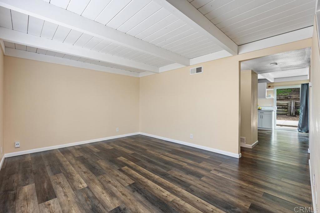 921 Lemon Avenue Vista, CA 92084 - Photo 7 of 32 a view of an empty room with wooden floor