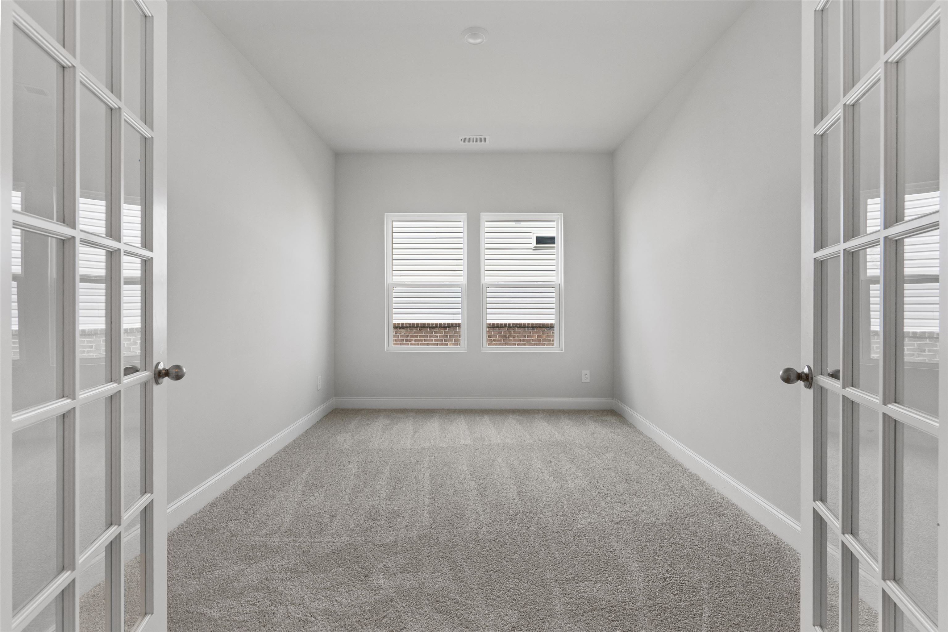 2495 Campton Loop Conway, SC 29527 - Photo 18 of 27 Empty room with french doors and light carpet