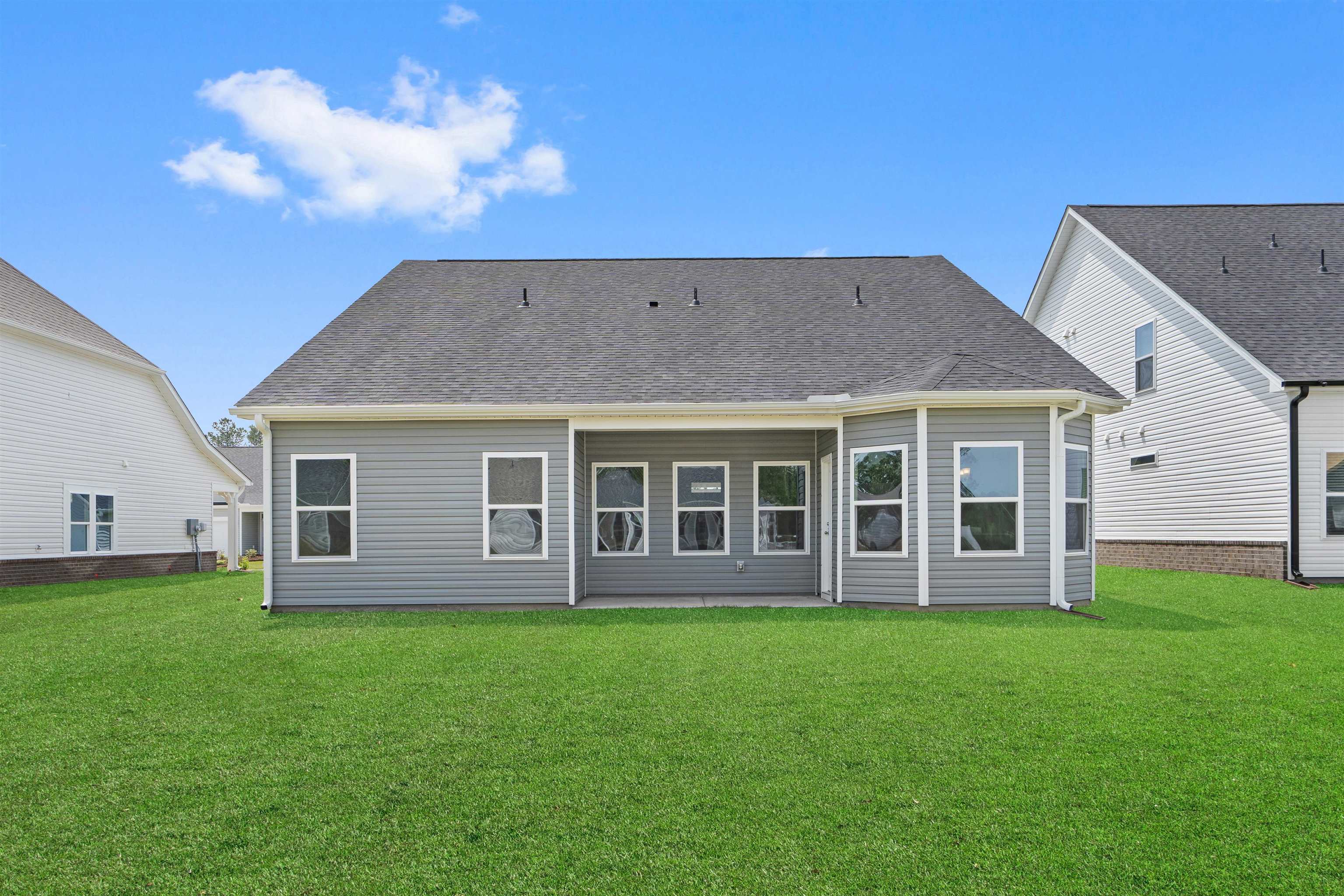 2495 Campton Loop Conway, SC 29527 - Photo 22 of 27 Back of house featuring a lawn, a patio area, and roof with shingles
