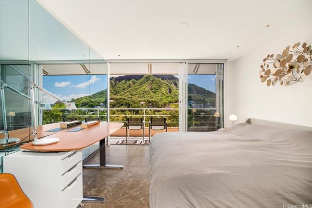a vase of flowers sitting on a table with six mirrors