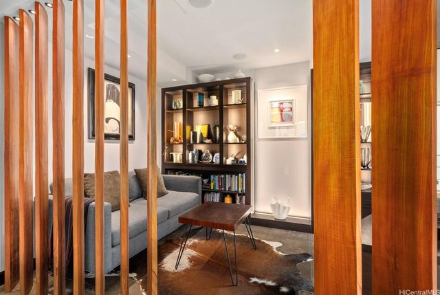 a bedroom with furniture and a wooden floor