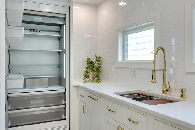 a kitchen with a cabinets and window