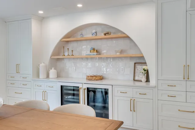 a dining room with furniture and a chandelier