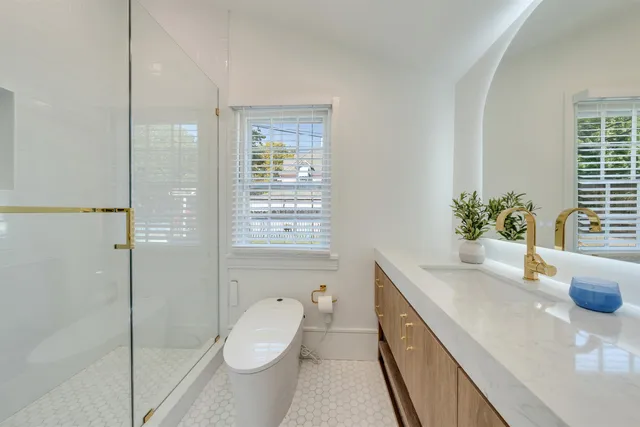 a bedroom with a bed and a lamp