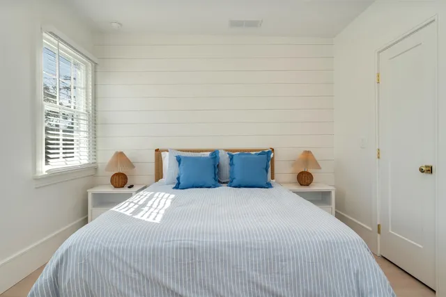 a view of a hallway with white walls
