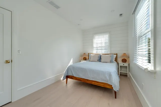 a view of staircase with wooden floor and a chandelier