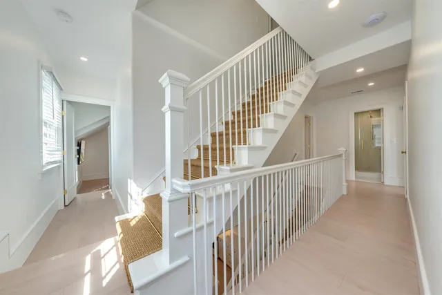 a bedroom with a bed and a mirror