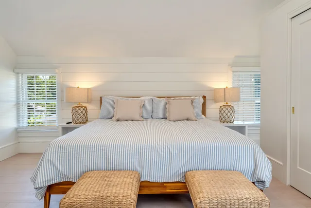 a bedroom with a bed and a cabinets