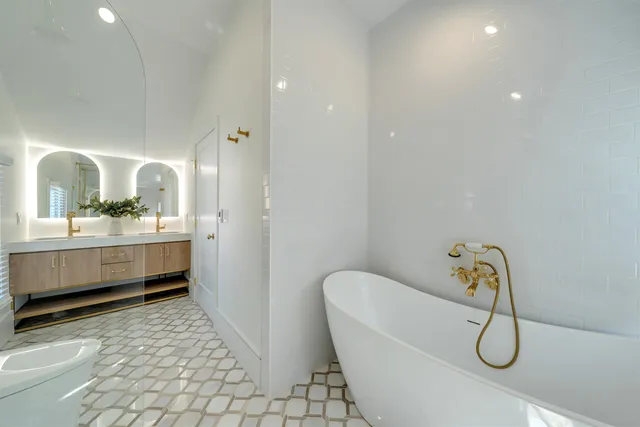 a bedroom with a bed and a window with kitchen view