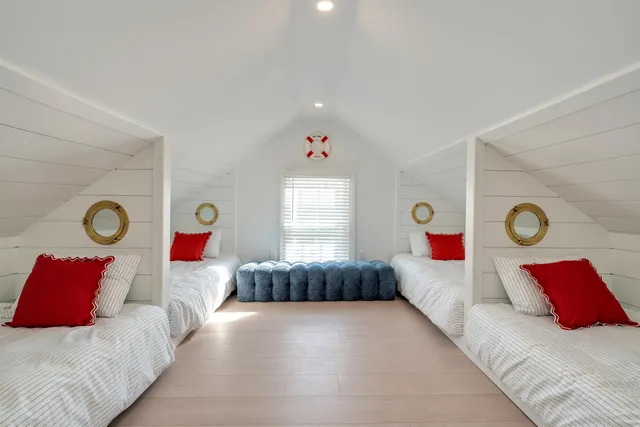 a bedroom with a bed and a couch