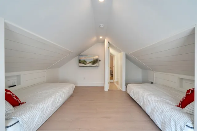 a bedroom with a bed and cabinets