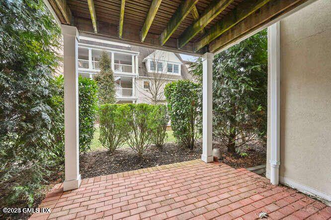 51 Forest Avenue, Unit 147 Old Greenwich, CT 06870 - Photo 11 of 19 a view of a porch with plants and wooden fence