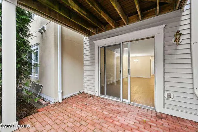 a living room with furniture wooden floor and a flat screen tv