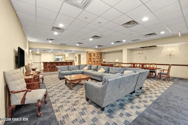 a view of a swimming pool and a yard