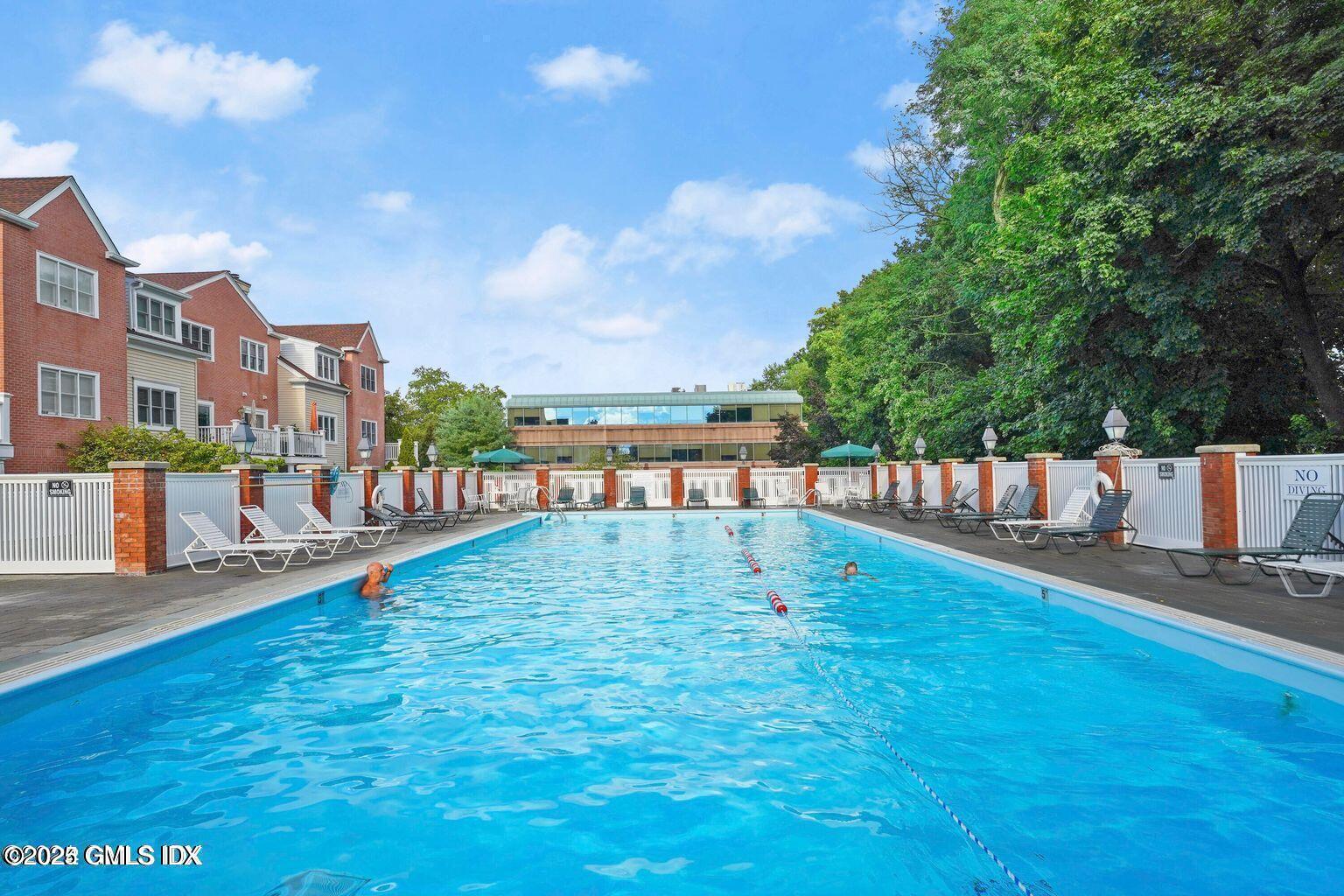 51 Forest Avenue, Unit 147 Old Greenwich, CT 06870 - Photo 14 of 19 a view of a swimming pool and a yard