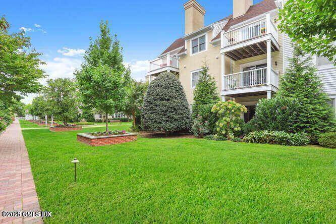 51 Forest Avenue, Unit 147 Old Greenwich, CT 06870 - Photo 15 of 19 a view of a house with a yard and sitting area