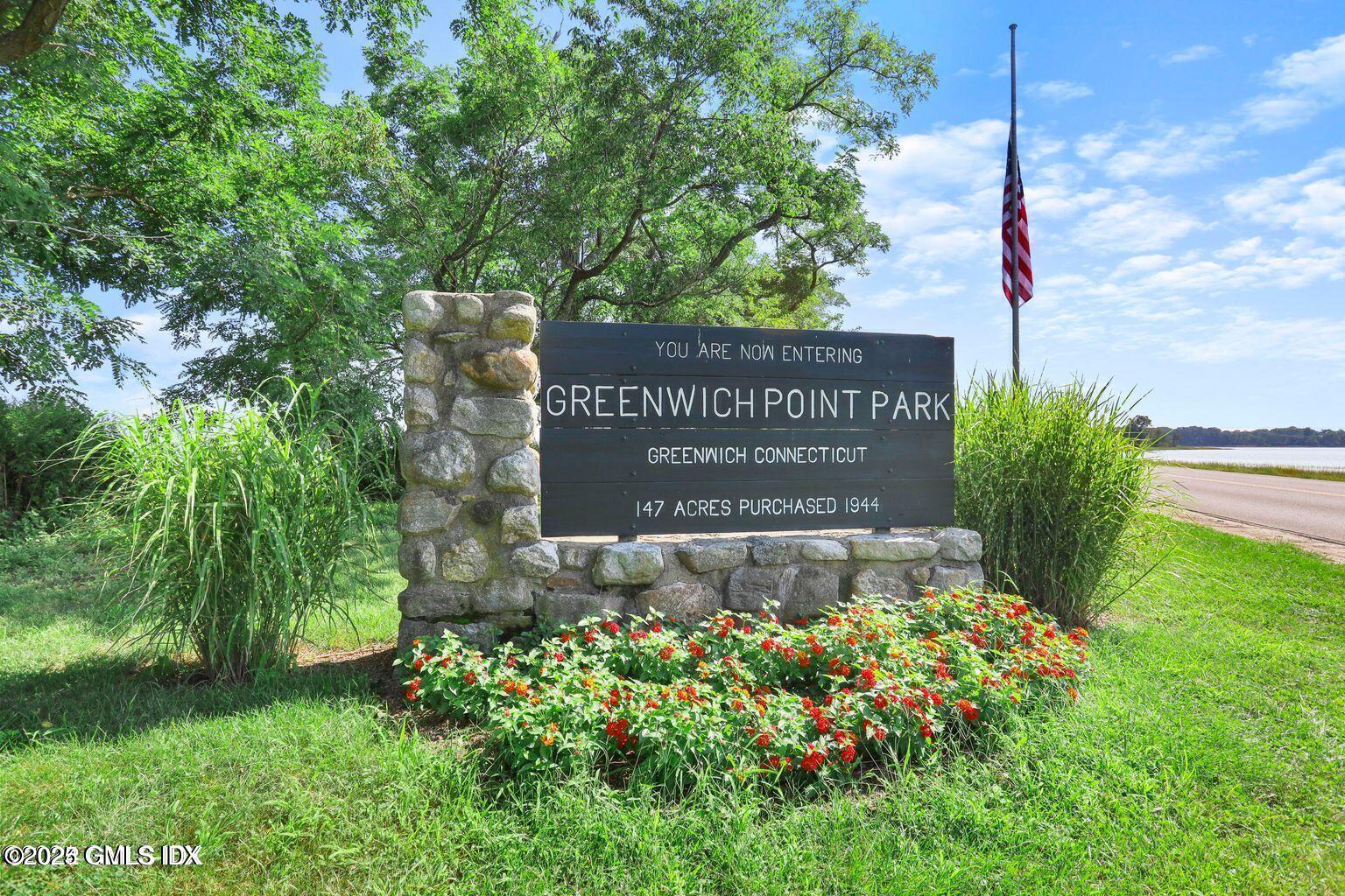 51 Forest Avenue, Unit 147 Old Greenwich, CT 06870 - Photo 16 of 19 a sign broad in front of flowers