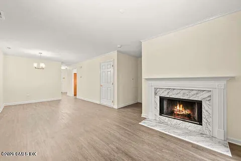 a view of an empty room with a fireplace