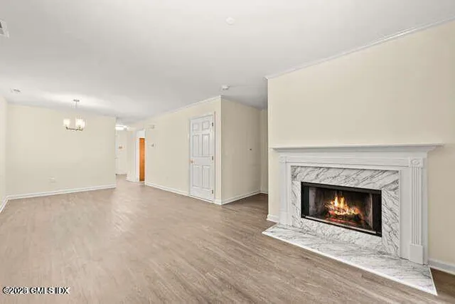 a view of an empty room with a fireplace
