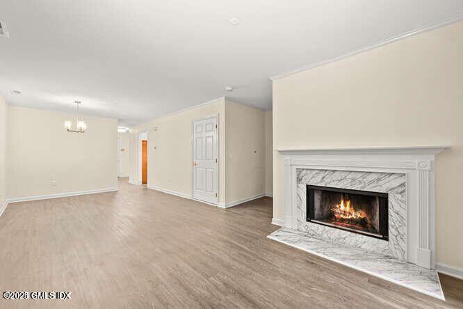 51 Forest Avenue, Unit 147 Old Greenwich, CT 06870 - Photo 3 of 19 a view of an empty room with a fireplace