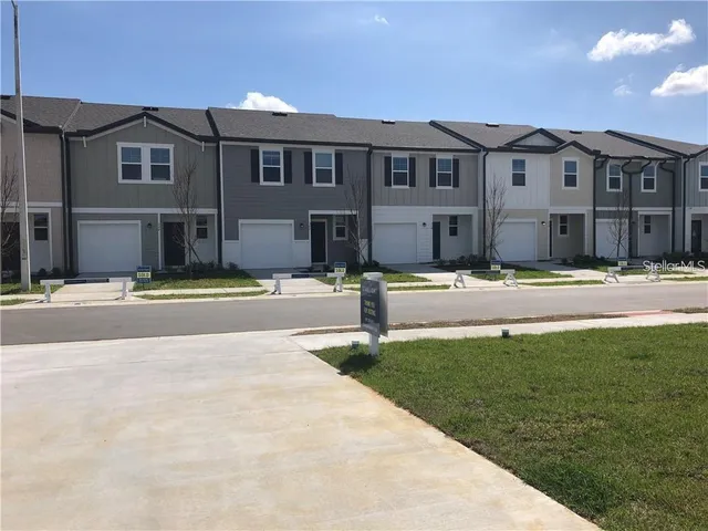 a front view of building with yard