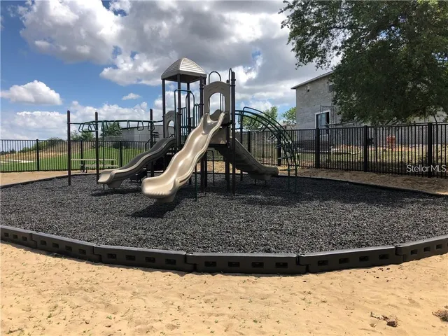 a view of a park with a slide
