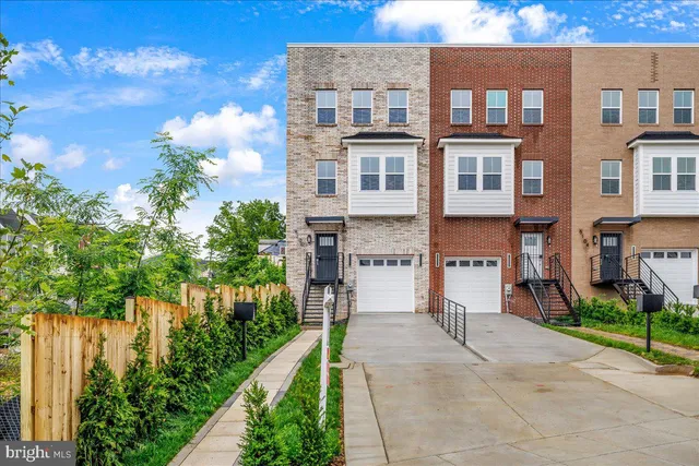a view of a brick building next to a yard